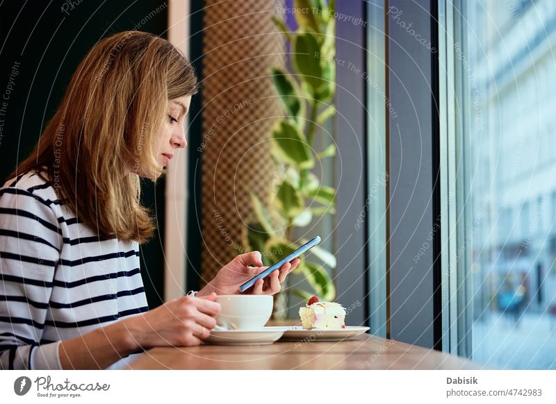 Woman have breakfast at cafe, use smartphone at cafe coffee communication online message digital freelance mobile coffee break media cake food morning woman