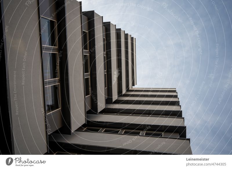 Facade of a multi-storey residential building with view upwards Balcony Concrete Prefab construction Apartment Building Modern Gray Upward Window Architecture