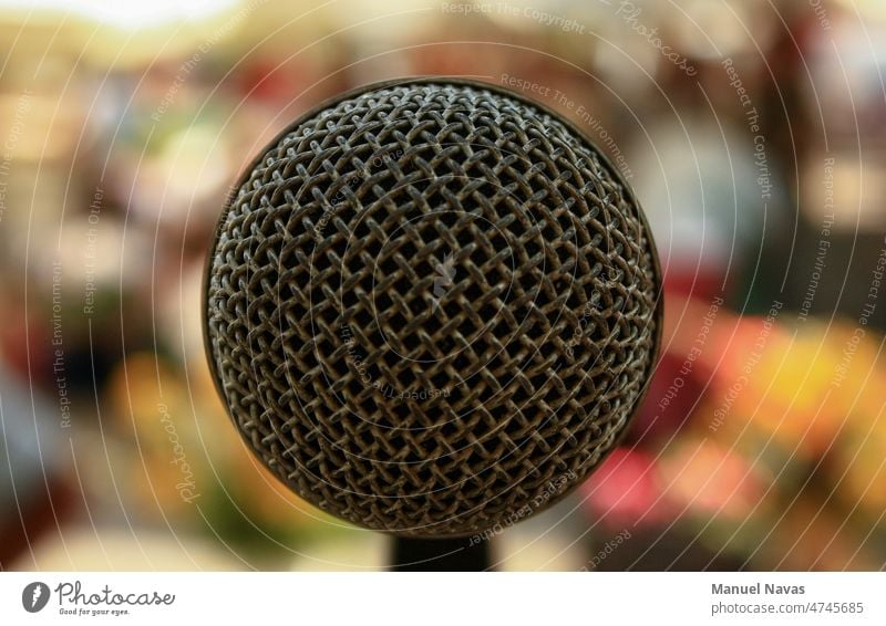 microphone from the singer's point of view, announcement audience audio background band black board broadcast close closeup communication concert conference