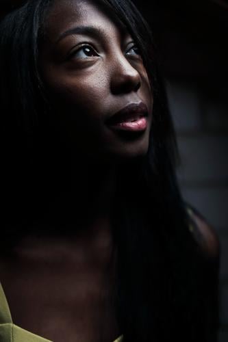 Young beautiful long haired woman standing in dark room looking up to the light Woman Young woman pretty Beauty & Beauty Graceful Friendliness PoC Long-haired
