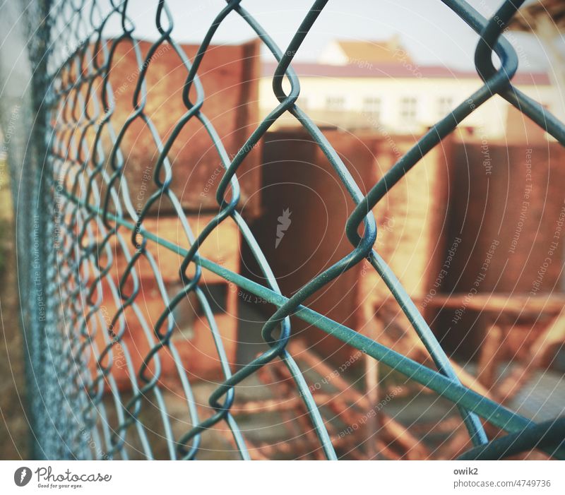 Company grounds Wire netting Boundary Barrier Plaited Complex Wire netting fence Metal Close-up Exterior shot Colour photo Border intertwined Detail