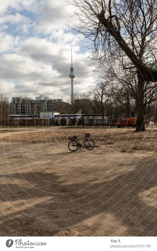 a lonely bicycle in the park. In the background the Berlin TV tower. Downtown Berlin Spring Bicycle Television tower Berlin TV Tower Landmark Capital city