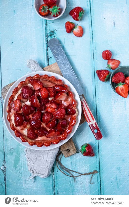 Delicious strawberry pie on table tart dessert serve dish cutting board spatula napkin sweet pastry food delicious yummy tasty appetizing wooden flavor