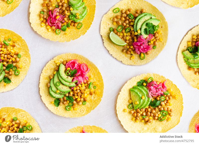 Fresh tortillas with various toppings taco mexican filling avocado chickpea traditional food kitchen culinary ingredient nutrition tasty delicious table fresh