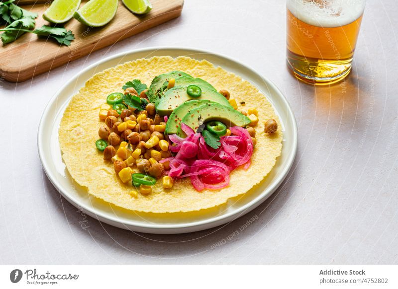 Fresh tortillas with various toppings taco mexican filling avocado chickpea traditional food beer kitchen culinary ingredient nutrition tasty delicious table
