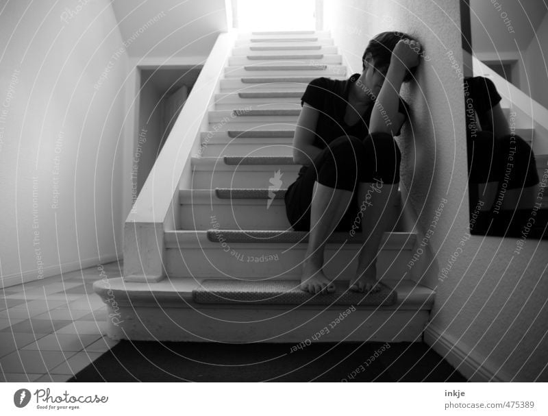 Sad woman sits on stairs Lifestyle Living or residing Flat (apartment) Staircase (Hallway) Stairs Woman Adults Body 1 Human being 30 - 45 years Crouch Sit