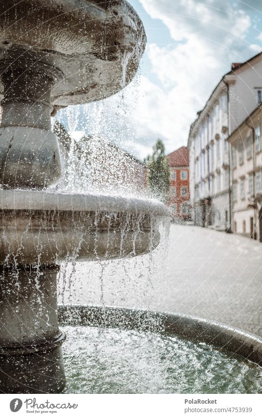 #A0# Squirt Fountain Water Well Slovenia Ljubljana Drops of water well edge Water fountain Inject