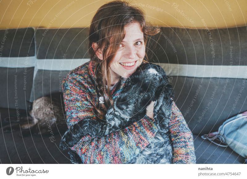 Young single woman spending time with her pet love together dog hug life lifestyle care caring soft fluffy happy happiness home cocker spaniel young youth fresh