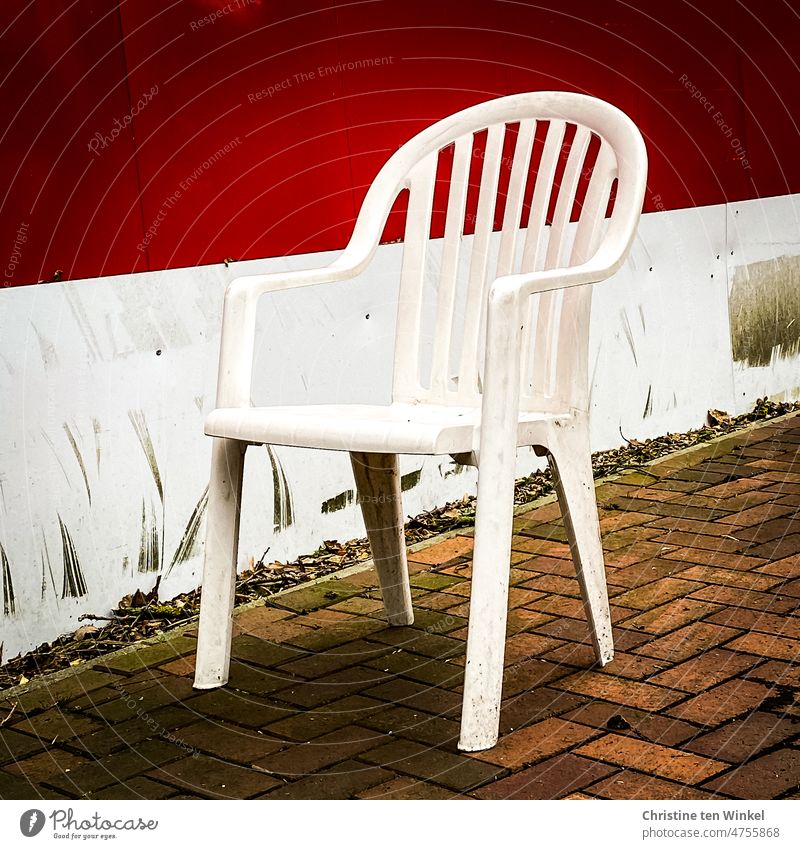 Dirty and dreary break area with a white plastic chair Plastic chair stacking chair monoblock Chair Garden chair Seating Outdoor furniture Deserted Empty Gloomy