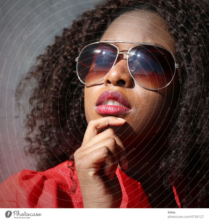 Woman with sunglasses Sunglasses Hand stop Skeptical Curl Dress Red Wall (barrier) portrait Meditative Half-profile Hand on chin
