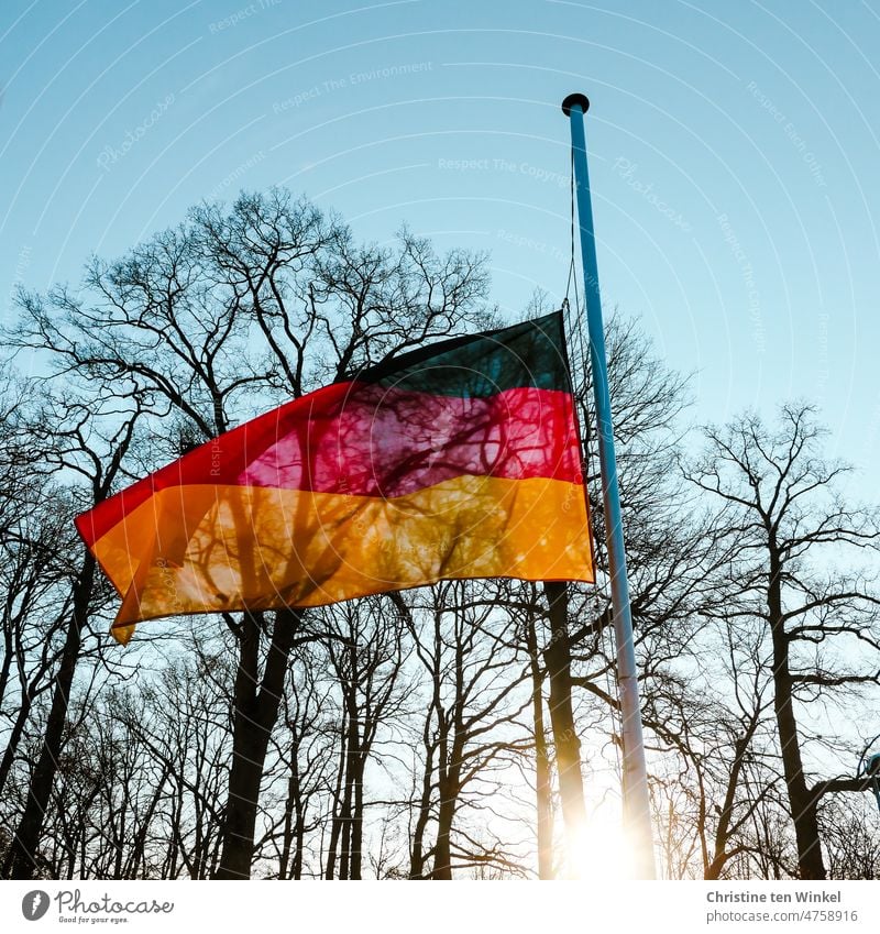 A German flag flies at half mast as a sign of mourning Grief Germany Ensign German Flag Patriotism Politics and state black-red-gold Nationalities and ethnicity