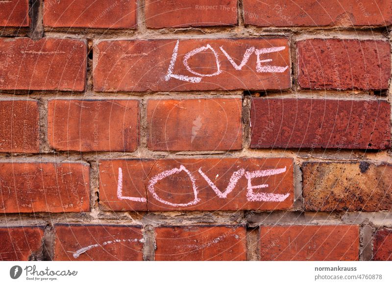 The word 'LOVE' on a wall Love token of love Painted mural painting Letters (alphabet) Brick Stone Background picture Red background Architecture symbol writing