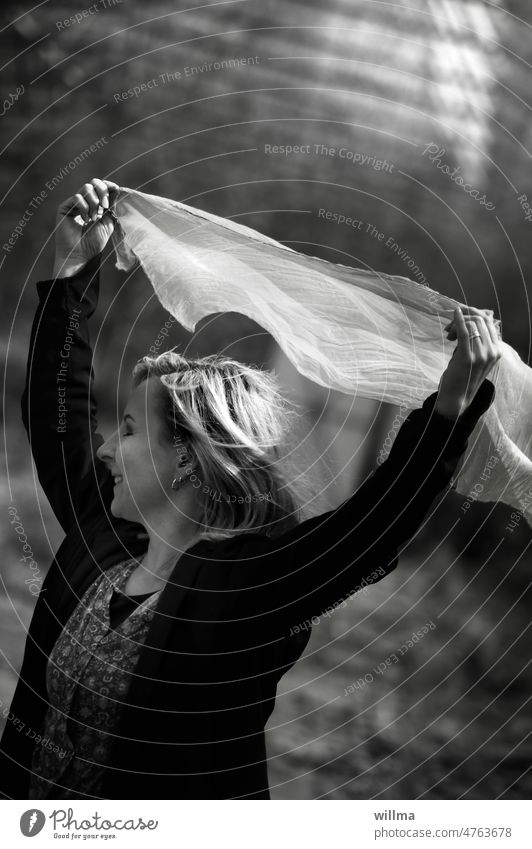 I am happy when it rains. Because when I'm not happy, it rains. Joy effusively Dance of joy Young woman Blonde feminine pleased fortunate Rag young girl B/W