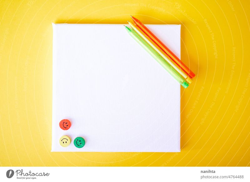 Back to school mockup in orange, yellow and green fluor tones mock up canvas childhood pen toys smile emoji smiley face pieces square stationary card