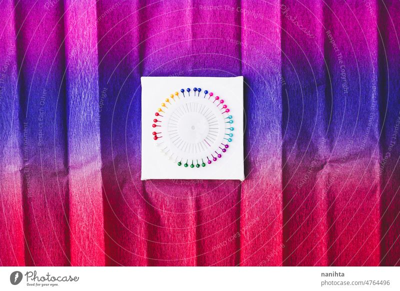 close up of a Rainbow and colorful circle made by pins rainbow haberdashery needle diversity variety vibrant brilliant round new arts and crafts couture sewing