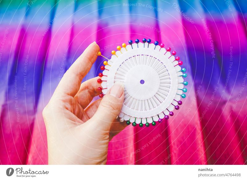 close up of a Rainbow and colorful circle made by pins rainbow haberdashery needle diversity variety vibrant brilliant round new arts and crafts couture sewing