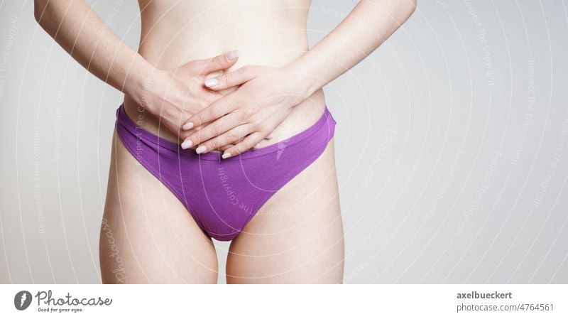 woman in panties holding belly with abdominal or period pains health ache endometriosis menstrual lower stomach hand disease lady healthcare underwear digestion