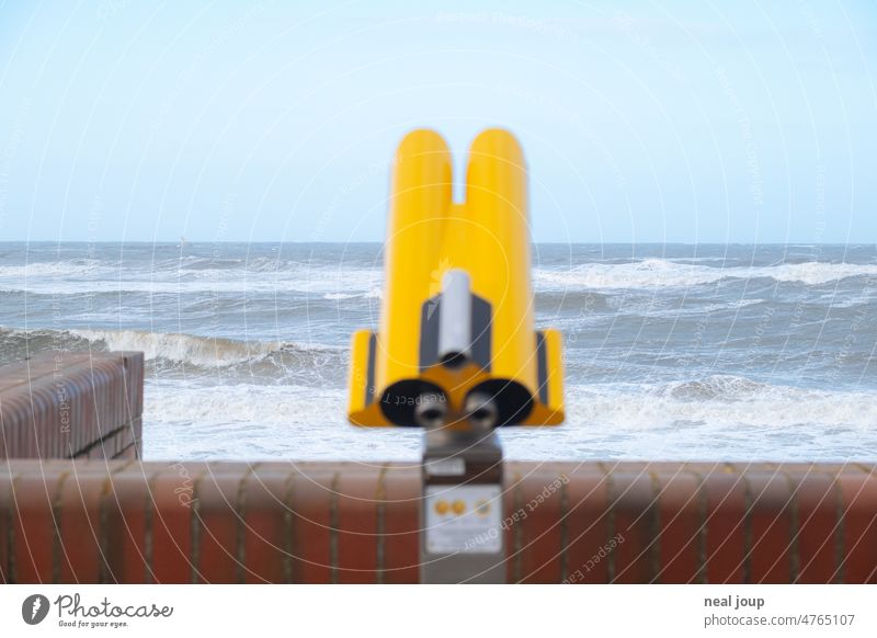 Stormy sea with yellow binoculars in foreground Ocean Nature coast outlook Horizon Perspective farsightedness Binoculars shallow depth of field Yellow Blue Gale