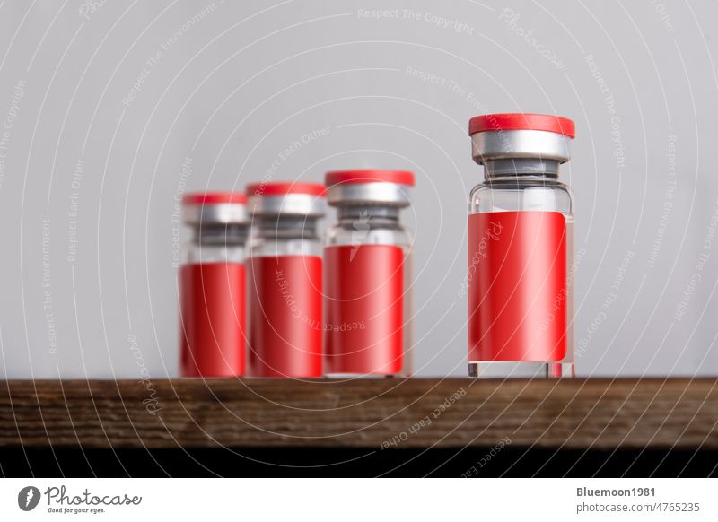 Medical vials for injection isolated on gray background mock-up editable change vaccine bottle corona medicine red laboratory care health close up Covid 19 drug