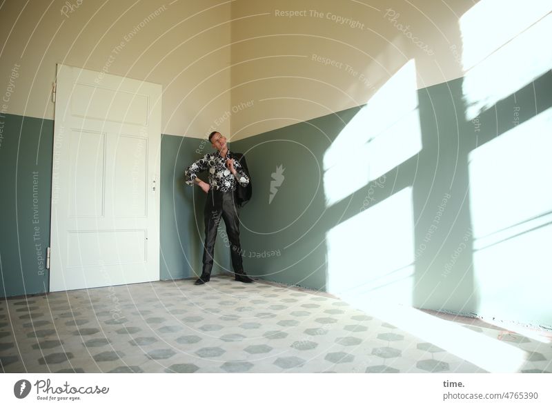 Man in a room looking at the sunlight Room Tile Masculine Adults Wall (barrier) Wall (building) Shirt Suit Brunette To hold on Short-haired To enjoy Looking