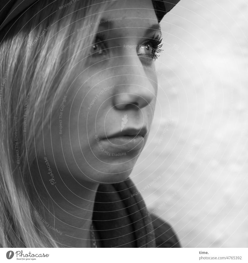 Woman with questioning look Looking full of worries feminine Blonde Profile portrait Hat Long-haired Half-profile asking