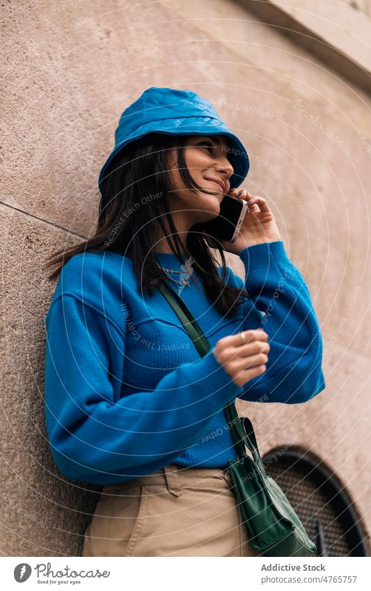 Woman talking on smartphone in city woman phone call conversation street street style urban chat communicate footpath appearance female town lady attractive