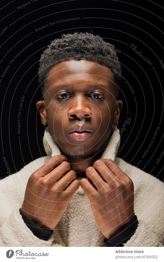 African American male in warm cardigan man model personality individuality style studio collar appearance portrait confident calm serious ethnic young
