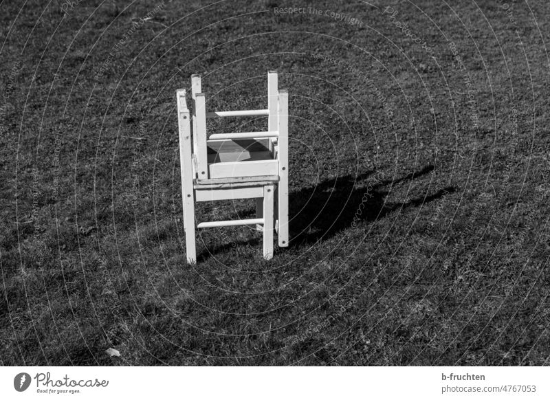Two small white wooden chairs stacked on top of each other Armchair Seating Furniture Deserted Chair Empty seat Grass Meadow Stand by oneself