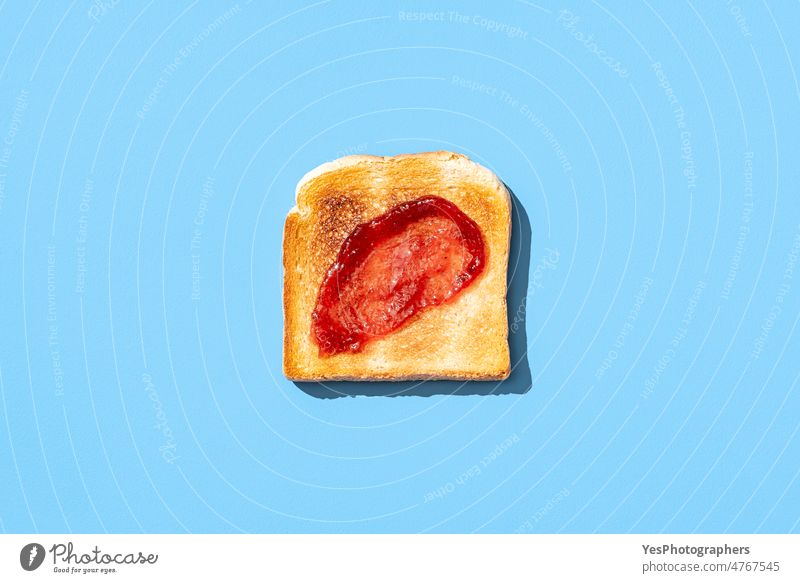 Toast bread with strawberry jam isolated on a blue background above breakfast bright close-up color crunchy crust cut out delicious dessert flat lay food fruit