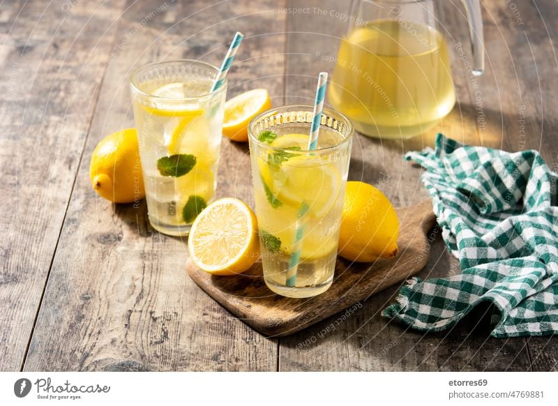 Glass of fresh lemonade beverage citrus cold copyspace delicious drink drops fruit glass homemade isolated jar juice juicy liquid mint refreshing refreshment
