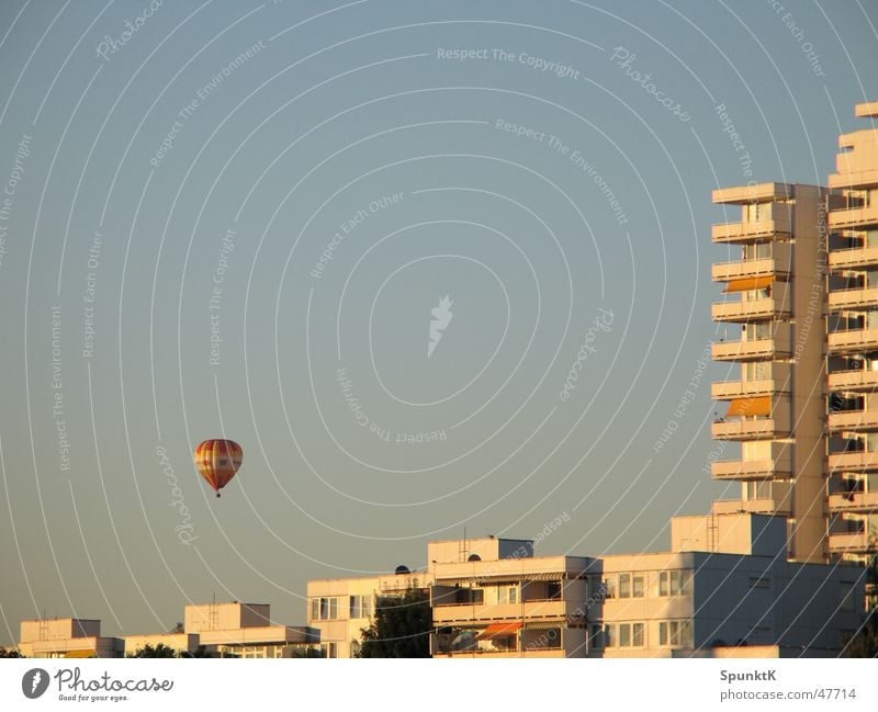 balloon Hot Air Balloon House (Residential Structure) High-rise Tower block Balcony White Evening sun Cologne Prefab construction Sky Beautiful weather Orange