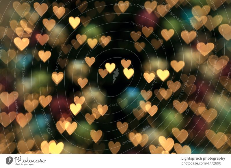Abstact heart-shaped bokeh background texture. abstract light romance love - emotion christmas valentine's day blur holiday bright valentine card gold lights