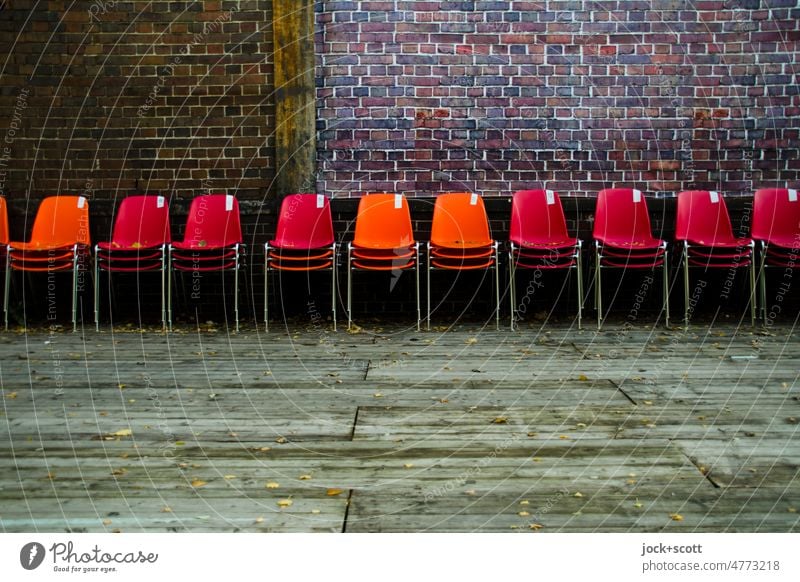 All chairs set aside Row Seating Seating capacity Places Deserted Empty Row of chairs Chair Row of seats Brick wall Platform Wooden board Plastic chair Many