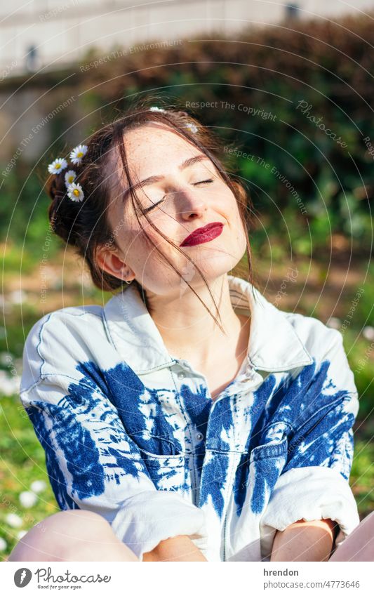 woman with flowers in her hair outdoors beauty smile happy smiling happiness freedom nature joy outside lifestyle springtime one person young adult coiffure