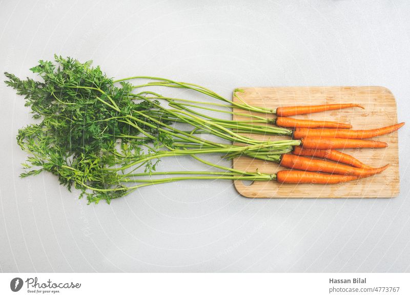 Portrait of carrots with green leaf placed over surface vegetables Fresh Carrot leaves Orange Red Food Kitchen kitchen herbs