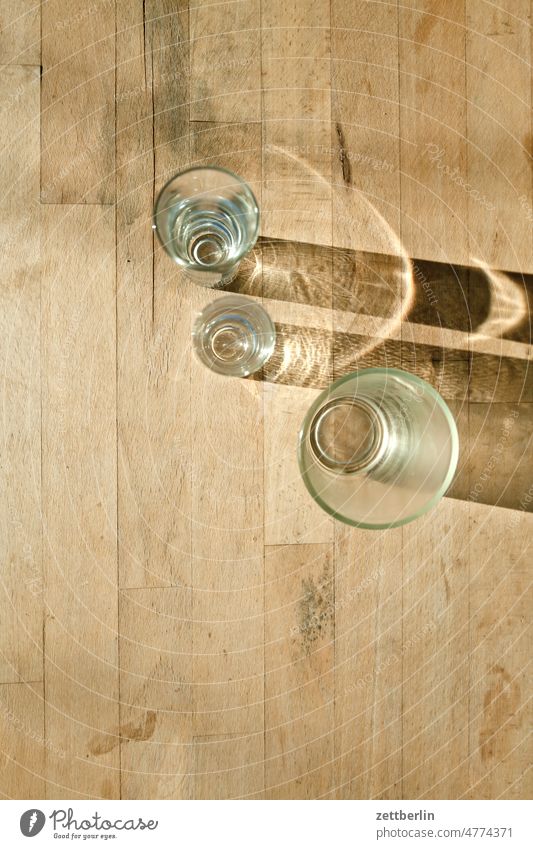 Shadow of glasses on the table Table Bird's-eye view Glass drinking glass Beverage Drinking Thirst Wood Wooden table Wood grain Light Refraction Prism