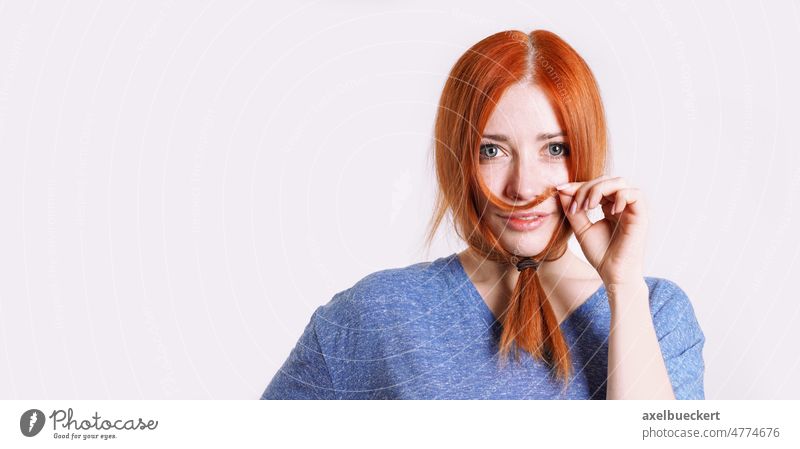 playful woman in disguise with hair tied to long beard facial hair gender identity funny silly girl smile female person people caucasian white red young adult