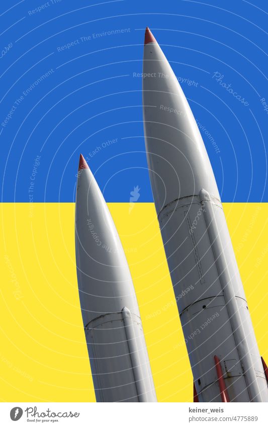 Two missiles in front of the colors of Ukraine Weapons War delivery of arms Ukraine war Blue Yellow nuclear weapons Bombs World War Armour Nuclear war Shell