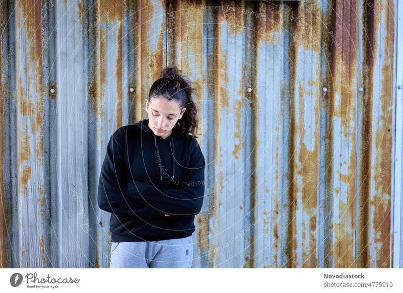 Portrait of a 13 year old girl looking pensive and thoughtful Portrait photograph Girl teenager teenage girl Isolated alone Sadness sad upset casual clothing