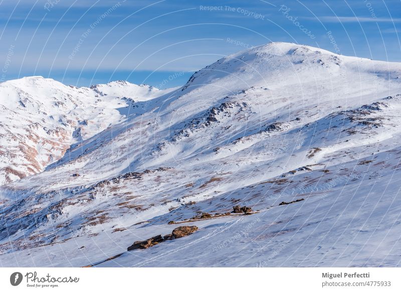 Winter landscape of Mulhacen, Poqueira ravine and Poqueira refuge, the only assisted refuge in Sierra Nevada. South slope. sierra nevada snow mountain winter