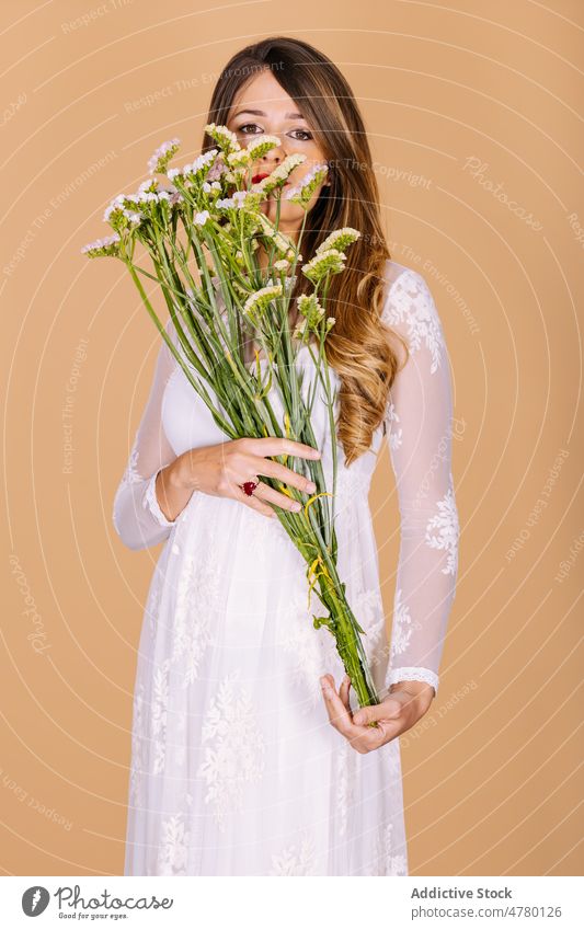 Bride in dress smelling flowers woman bride white dress wedding style occasion bouquet floral event elegant plant present fragrant aroma holiday fashion apparel