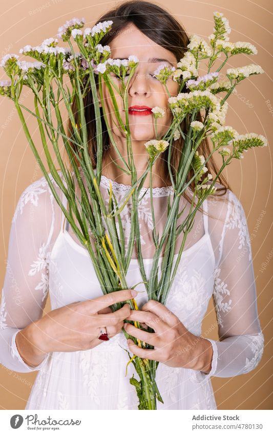 Bride in dress smelling flowers woman bride white dress wedding style occasion bouquet floral event eyes closed elegant plant present fragrant aroma holiday
