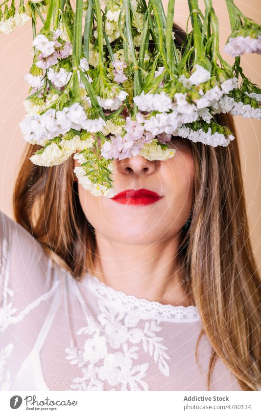 Anonymous bride covering eyes with flowers woman white dress wedding style occasion bouquet floral cover eyes hide event elegant plant present smell fragrant