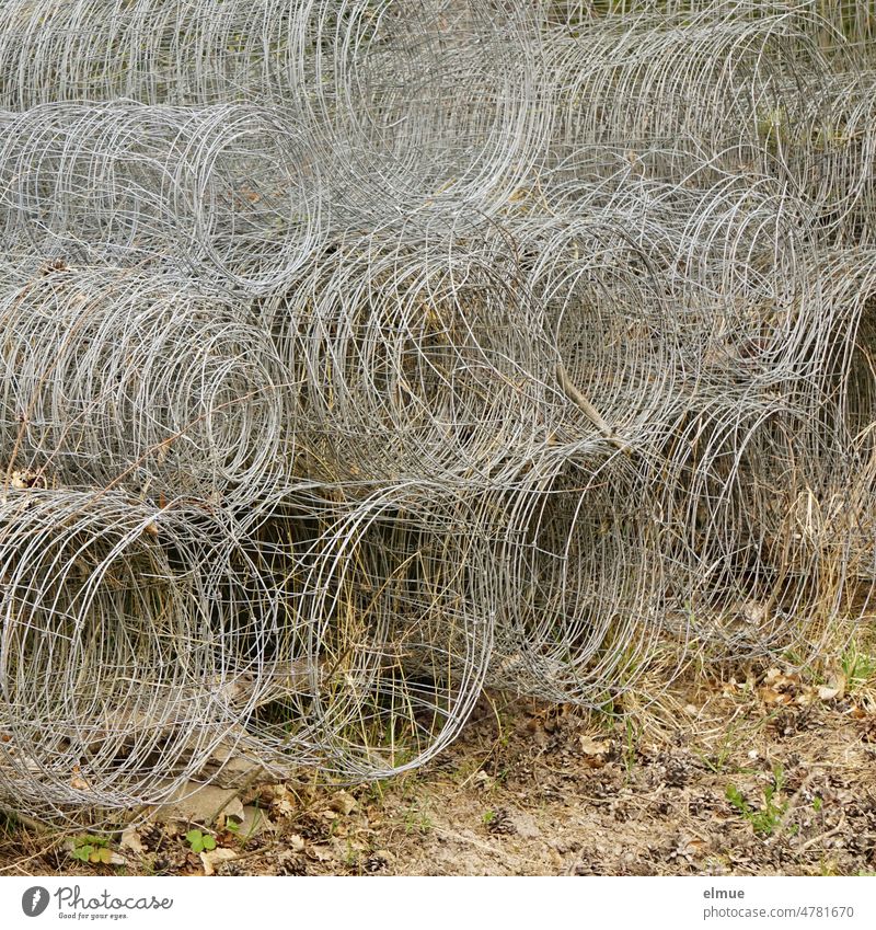 numerous stacked rolls of wire fence / construction / demarcation Wire fence Stack Garden fence Wire netting fence Metal Collection Blueprint