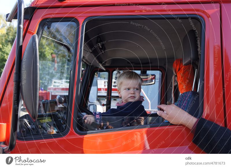 Childhood | sitting in the fire truck and not being bothered. people Human being Toddler car Fire engine Car Window Red dark blue Sit steer Driving try