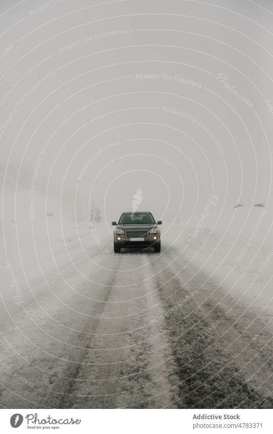 Car driving on snowy road car drive winter countryside hoarfrost speedway road trip automobile cold fog weather vehicle route frozen straight nature transport