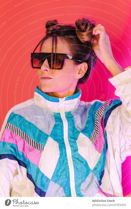 Stylish woman in black sunglasses retro style old fashioned portrait outfit appearance vintage apparel studio colorful female vivid creative bright epoch