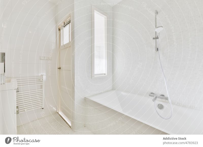 Interior of bathroom with sink and mirror interior modern light minimal design contemporary apartment wooden bathtub lightning hygiene style door ceramic tile