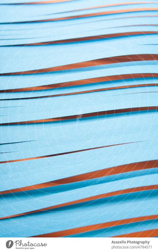 Blue cit paper strips background. Simple color paper background in blue and red. cut minimalism still life abstract lines stationary cutter knife texture