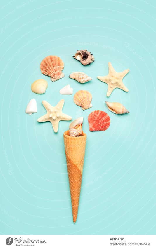 Ice cream cone with sea shells and starfish. Summer holiday concept summer holidays ice cream summertime beach vacation travel voyage planning isolated leisure